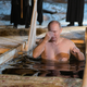 Russian President Vladimir Putin croses himself as he takes a dip in the water during Orthodox Epiphany celebrations at Lake Seliger, Russia on Jan. 19.